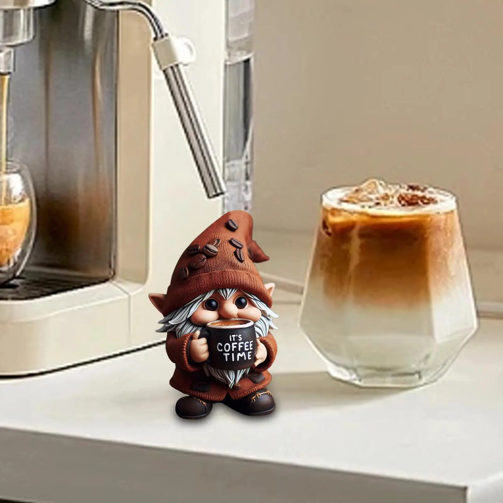 Gnome figurine holding a sign next to an iced coffee and espresso machine.