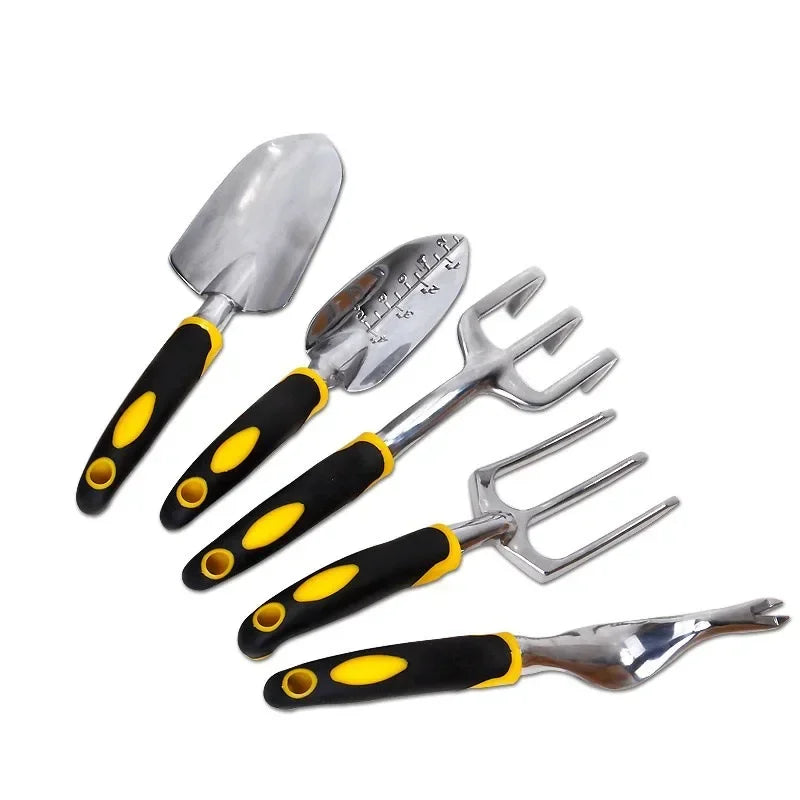Set of gardening tools with black and yellow handles on a white background