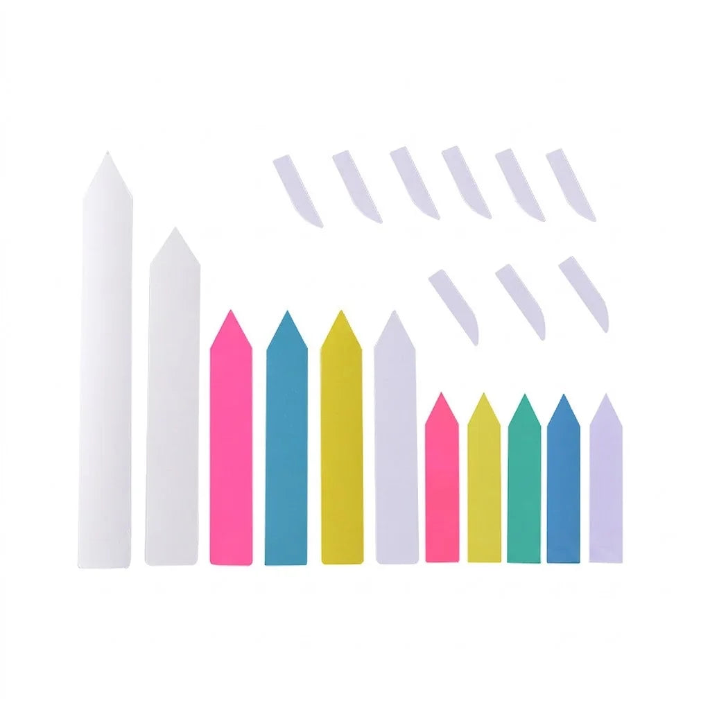 A set of colorful wooden fence pickets and matching stakes on a plain white background. The pickets come in multiple pastel and bright colors including pink, blue, yellow, green, and purple, alongside several white stakes.